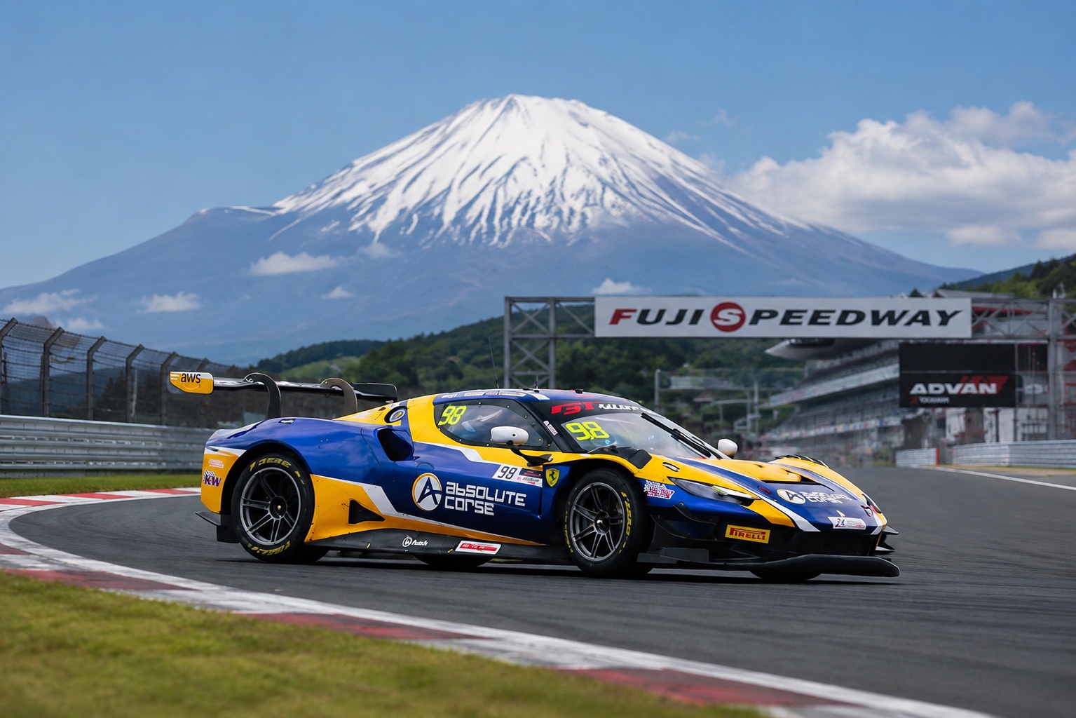 Absolute Corse Ferrari 296 GT3 on track at Fuji Speedway, Mount Fuji behind